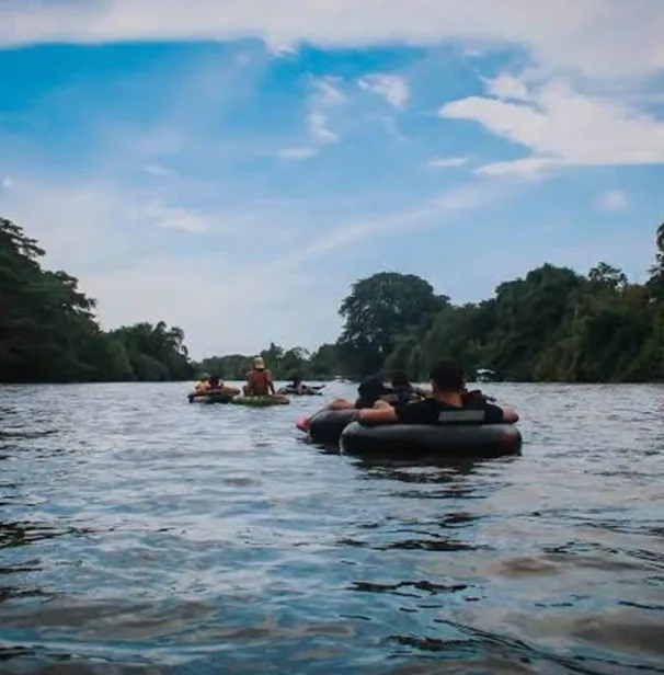 people tubing in a river
